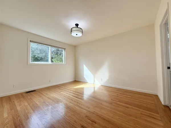 a bedroom with a bed and a table in it