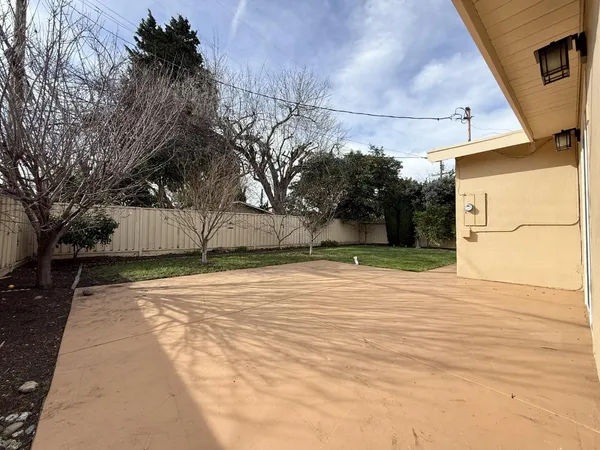 a backyard of a house with lots of green space
