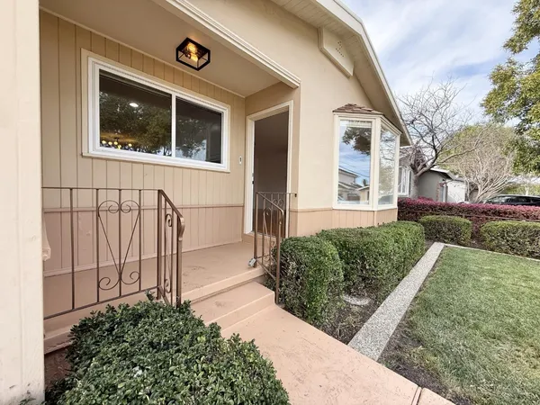 a front view of a house with a yard