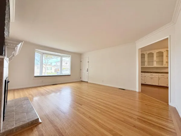 a view of a kitchen cabinets and wooden floor