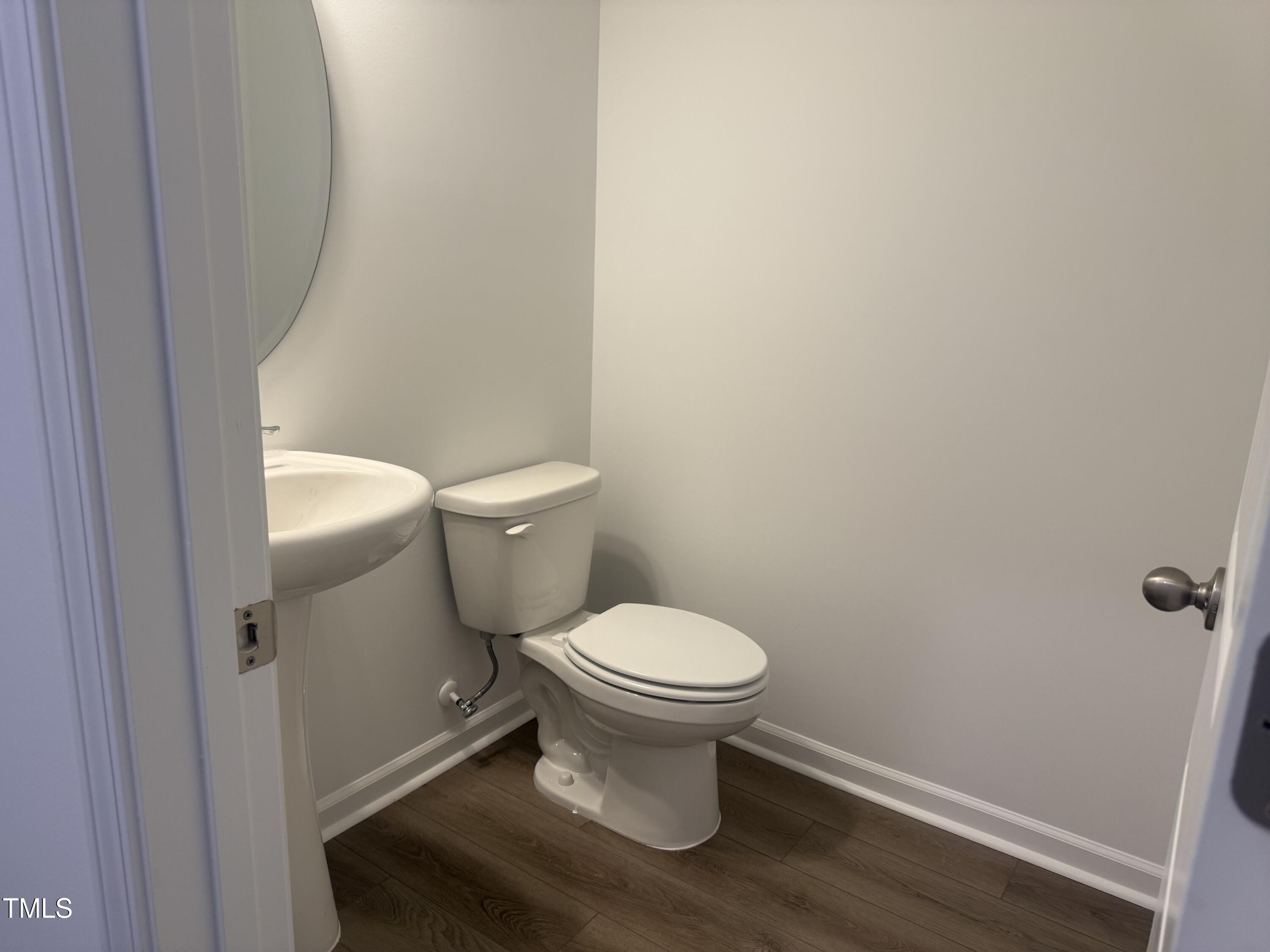 6828 Galloway Drive Middlesex, NC 27557 - Photo 11 of 32 a white toilet sitting next to a white sink