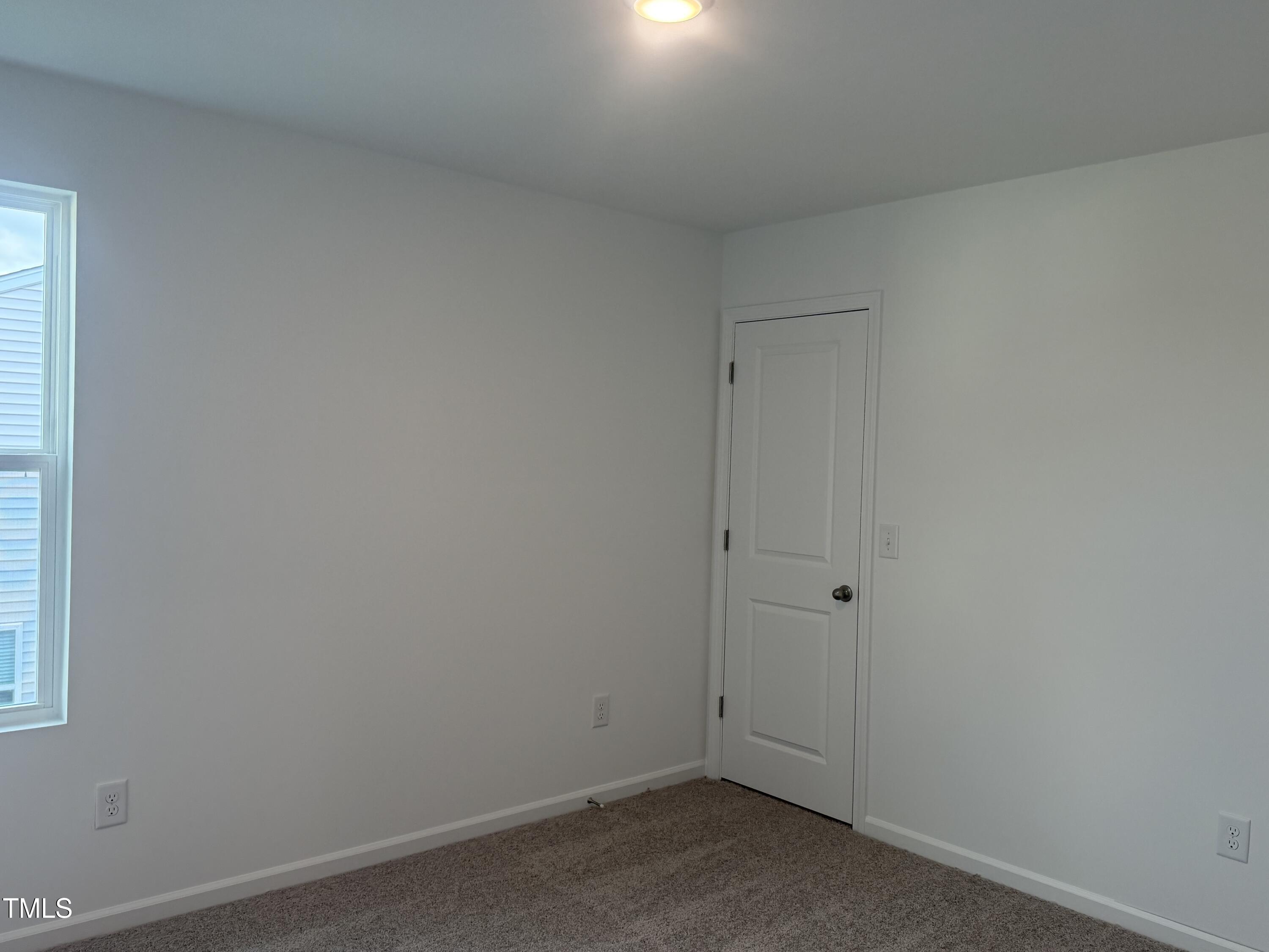 6828 Galloway Drive Middlesex, NC 27557 - Photo 12 of 32 an empty room with a window