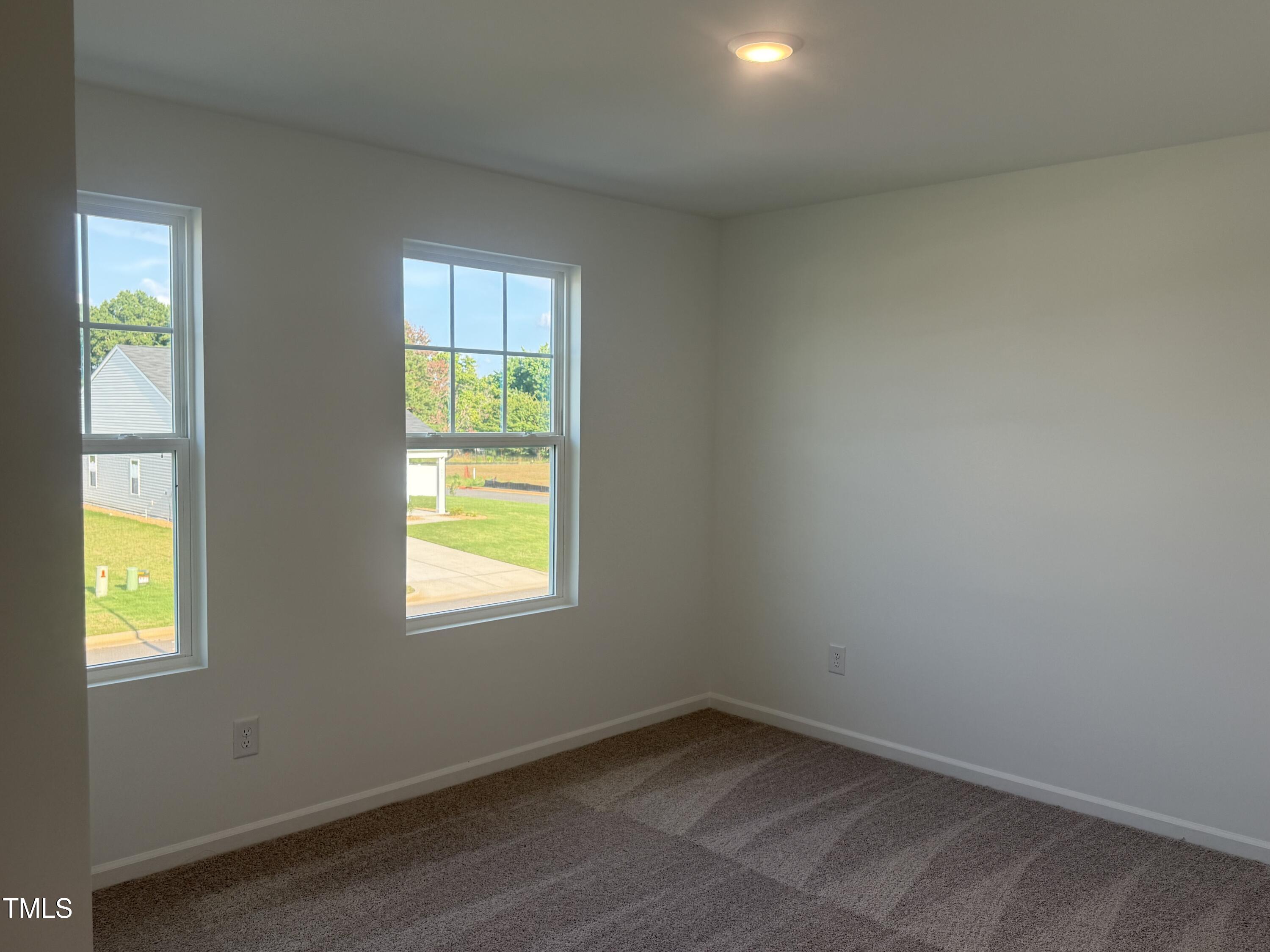 6828 Galloway Drive Middlesex, NC 27557 - Photo 13 of 32 wooden floor and window in an empty room