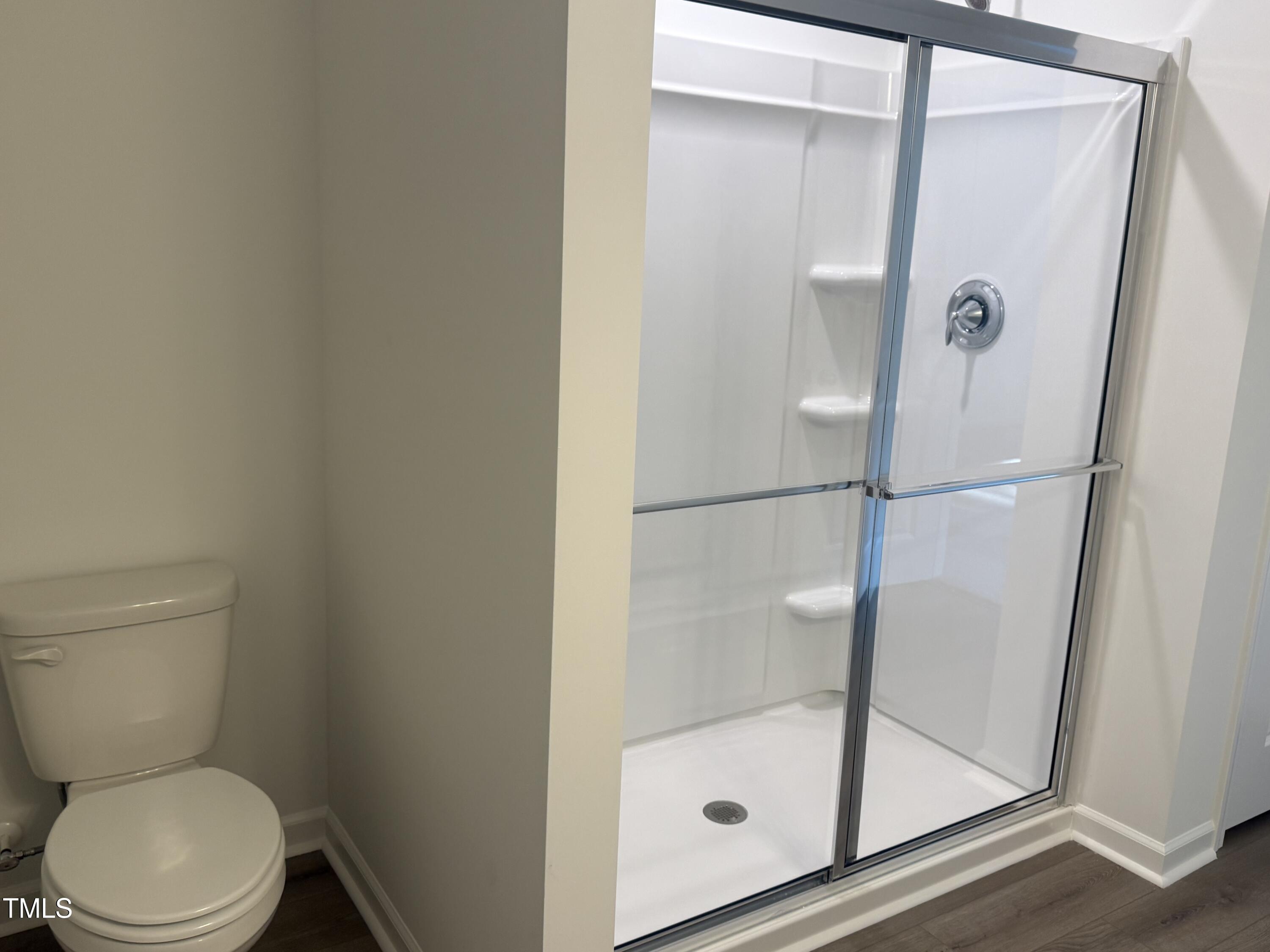 6828 Galloway Drive Middlesex, NC 27557 - Photo 14 of 32 a bathroom with a shower and toilet