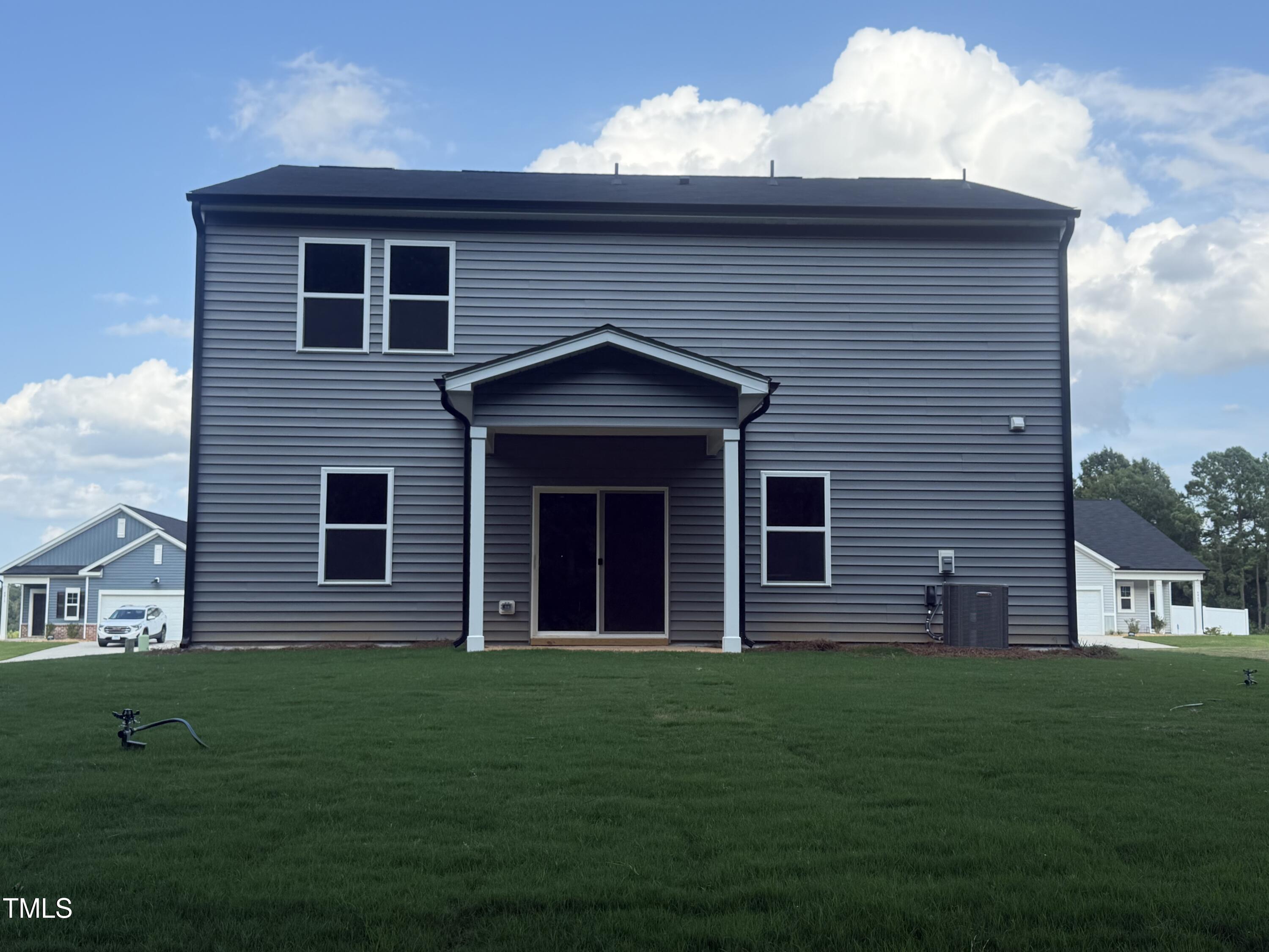 6828 Galloway Drive Middlesex, NC 27557 - Photo 28 of 32 a brick house with a small yard