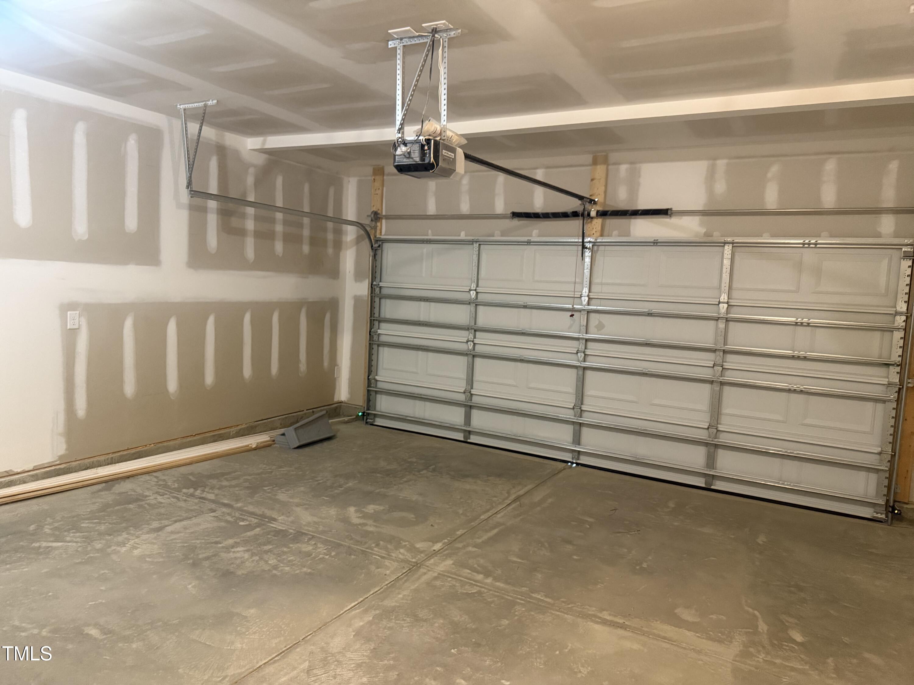 6828 Galloway Drive Middlesex, NC 27557 - Photo 30 of 32 a view of a garage with racks on the wall