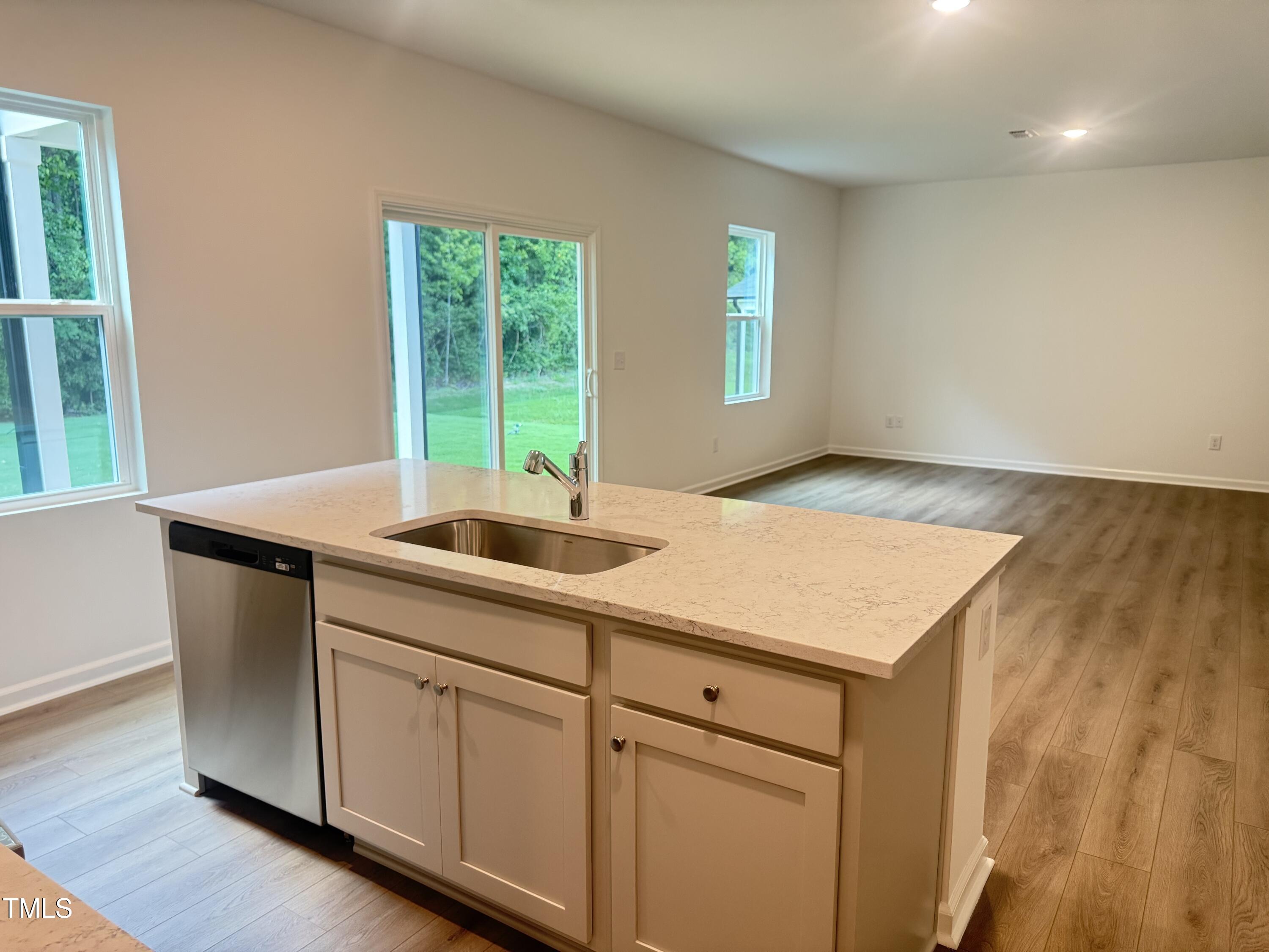 6828 Galloway Drive Middlesex, NC 27557 - Photo 6 of 32 a kitchen with a sink cabinets and wooden floor