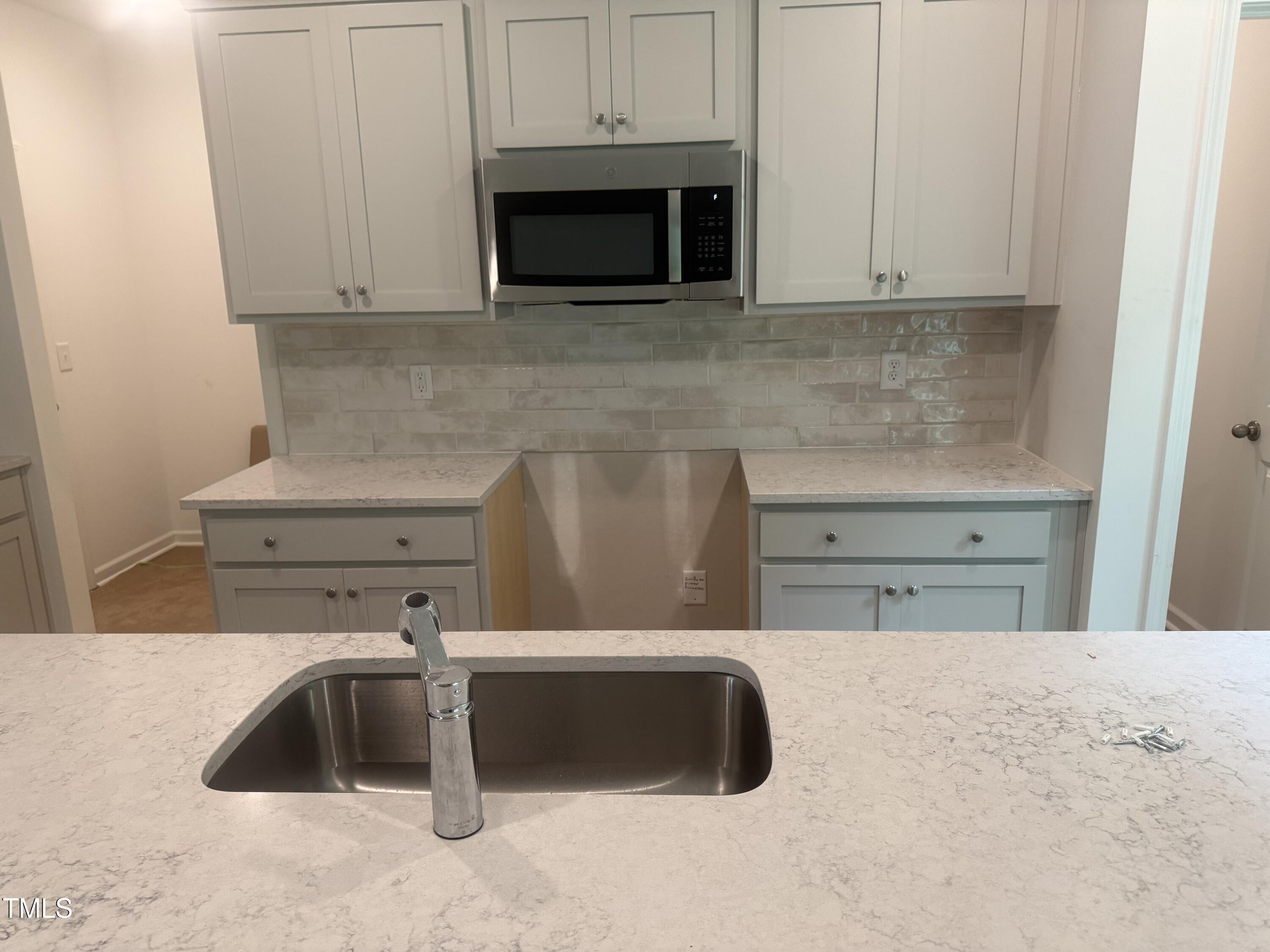 6828 Galloway Drive Middlesex, NC 27557 - Photo 8 of 32 a kitchen with a microwave and cabinets