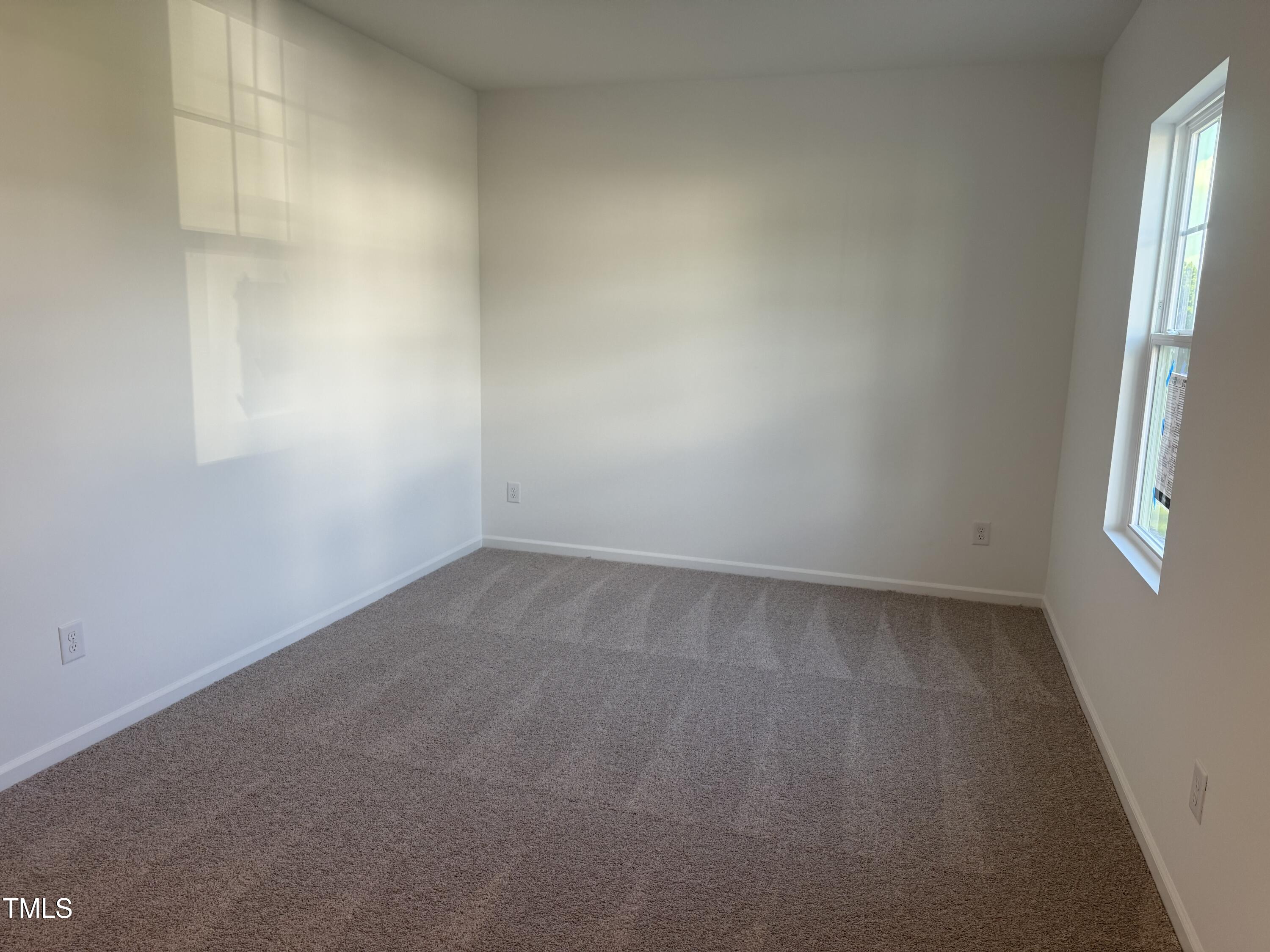 6828 Galloway Drive Middlesex, NC 27557 - Photo 9 of 32 an empty room with a window
