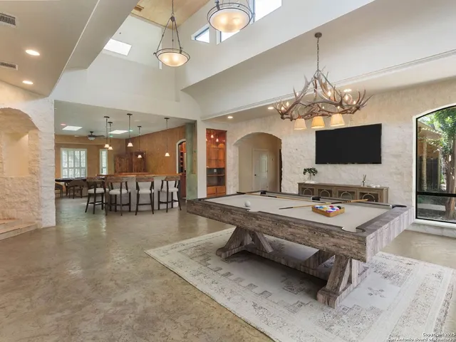 a view of kitchen with wooden floor and cabinets