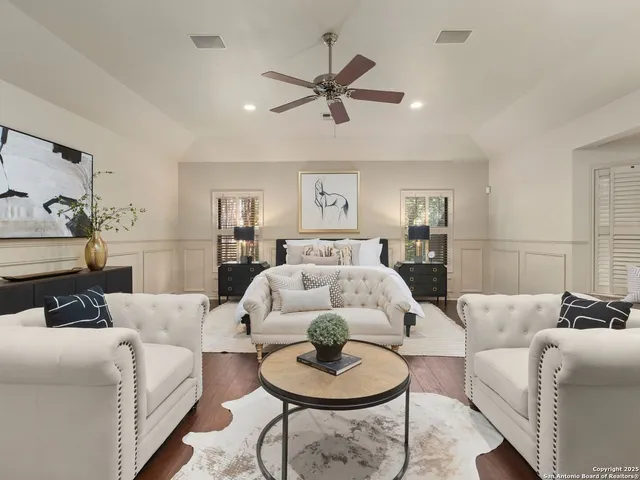 a large spacious bathroom with a tub and shower