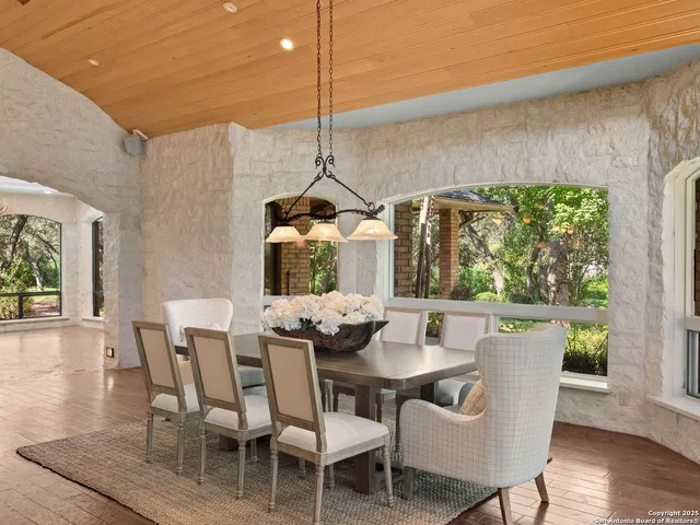 a kitchen with stainless steel appliances granite countertop a sink counter space cabinets and a stove