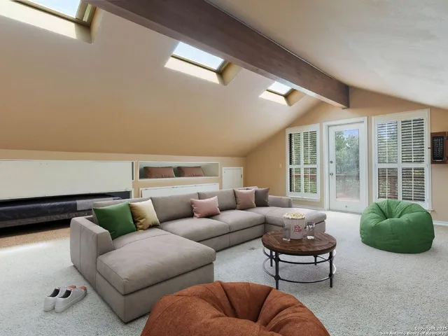 a kitchen with granite countertop white cabinets and stainless steel appliances