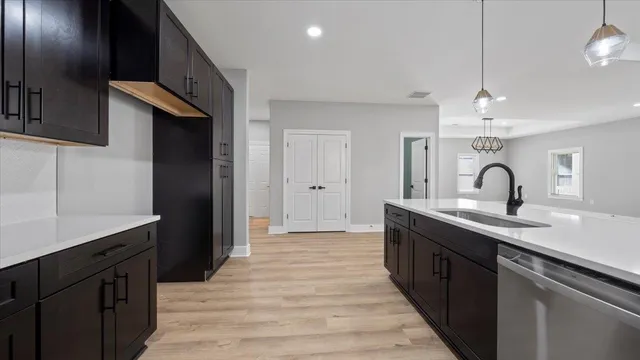 a spacious bathroom with a double vanity sink and a mirror