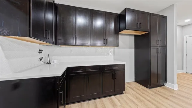 a kitchen with a sink and cabinets
