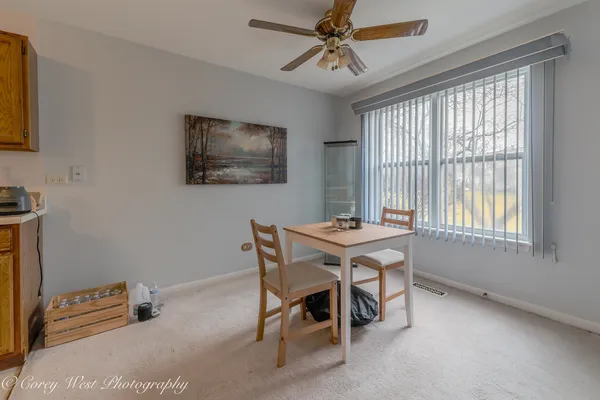 a view of a dining room with furniture window and outside view