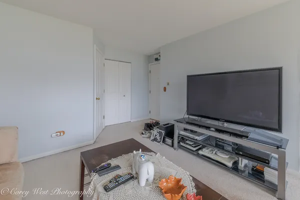 a room with furniture and a flat screen tv