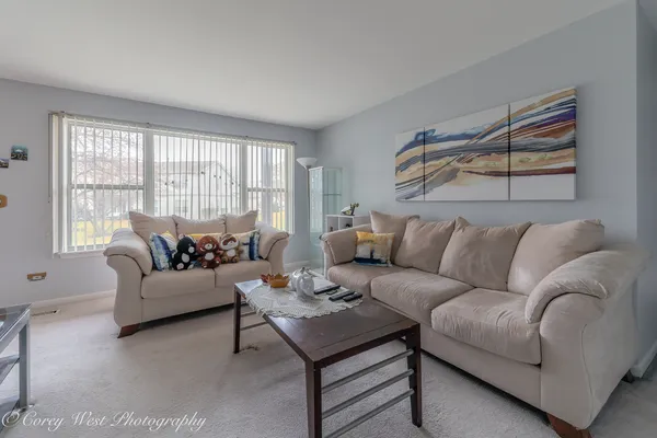 a living room with furniture and a window