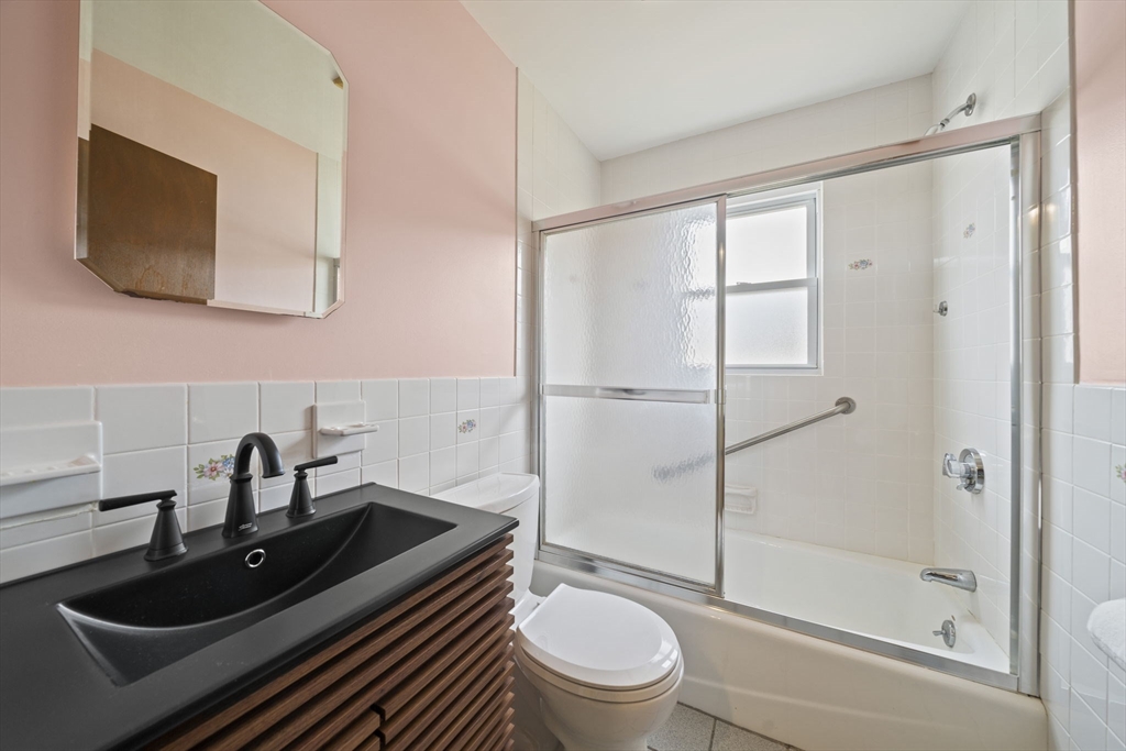 14 Crescent Road Weymouth, MA 02191 - Photo 11 of 19 a bathroom with a sink a toilet and shower