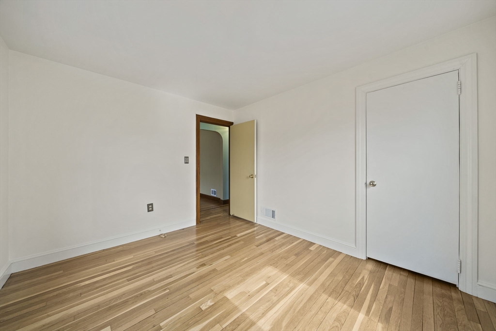 14 Crescent Road Weymouth, MA 02191 - Photo 8 of 19 a view of an empty room and wooden floor