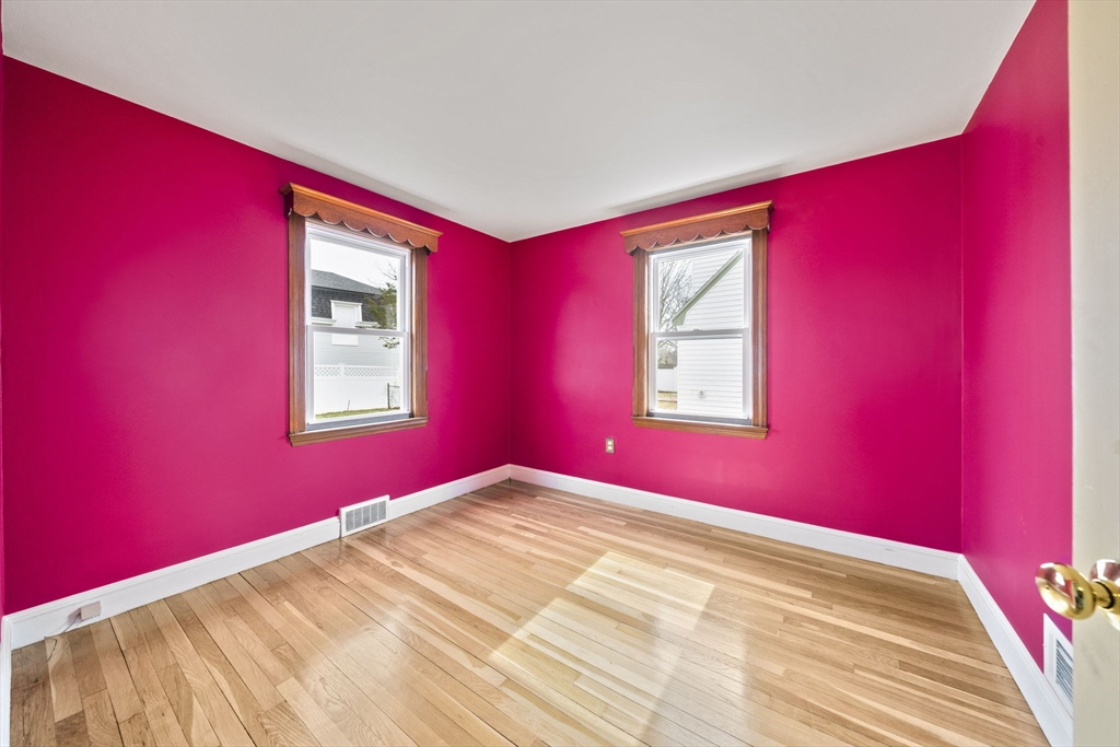 14 Crescent Road Weymouth, MA 02191 - Photo 9 of 19 a view of a bedroom with wooden floor and windows