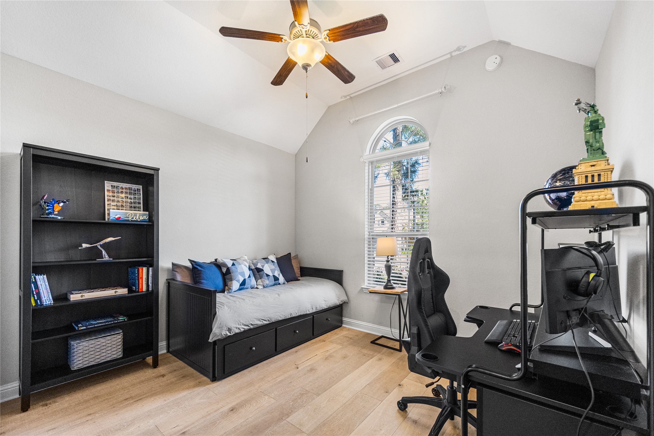 4320 Silver Oak Place Spring, TX 77386 - Photo 14 of 42 Secondary bedroom downstairs with its own en-suite bathroom, providing privacy and comfort.