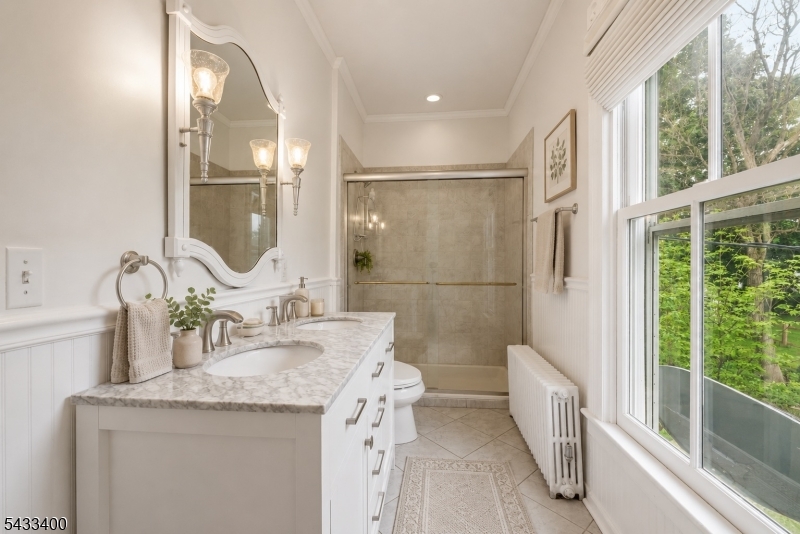 61 New Street Hampton, NJ 08827 - Photo 35 of 45 a bathroom with a granite countertop sink a mirror and shower
