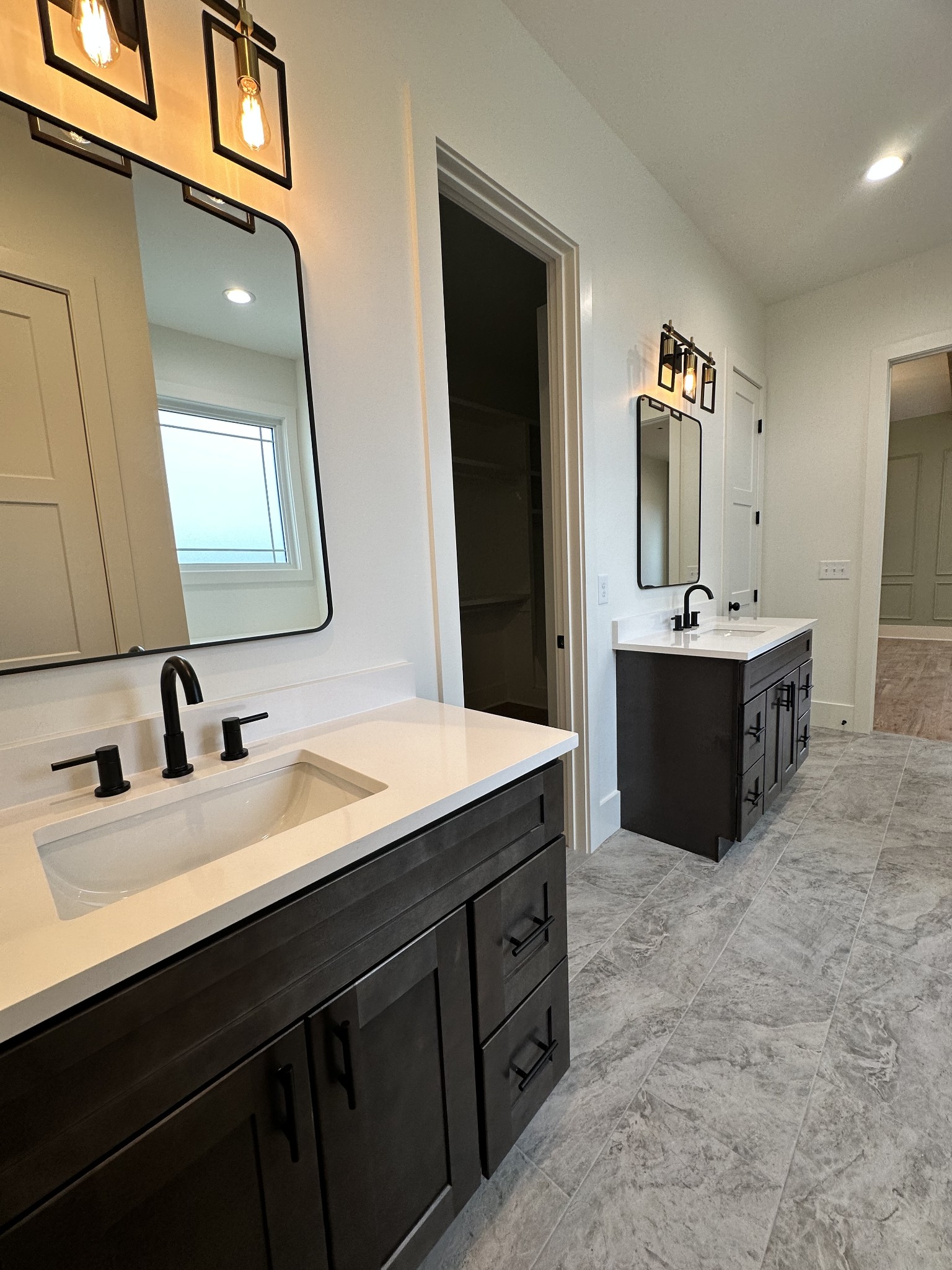 687 Burford Road Lebanon, TN 37087 - Photo 11 of 30 a bathroom with a double vanity sink mirror and bathtub