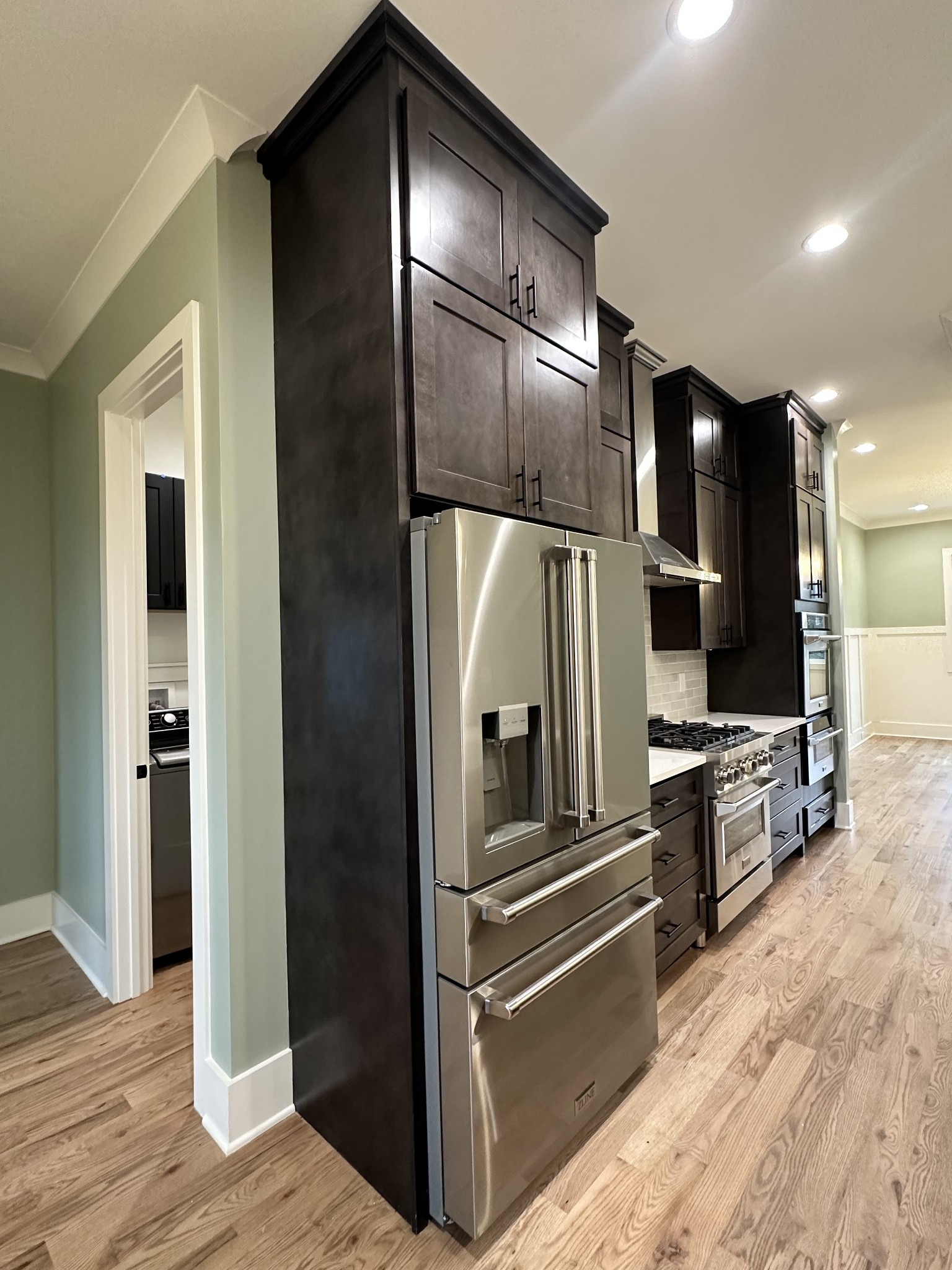 687 Burford Road Lebanon, TN 37087 - Photo 3 of 30 a kitchen with granite countertop stainless steel appliances and wooden floor