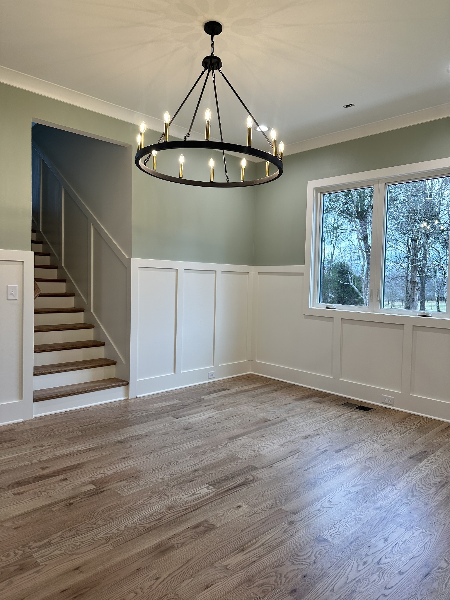 687 Burford Road Lebanon, TN 37087 - Photo 4 of 30 a view of an empty room with wooden floor fan and windows