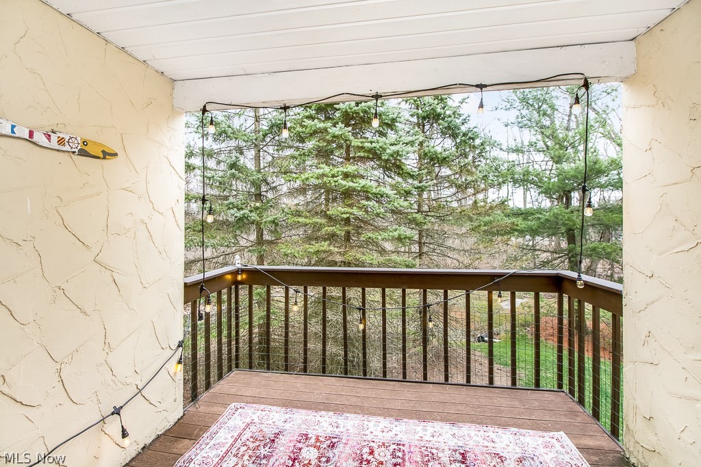 452 Hampton Ridge Drive Akron, OH 44313 - Photo 6 of 25 Wake up and enjoy a cup of coffee, or come home to unwind on this wonderful deck featuring beautiful views of the park and wooded lot.