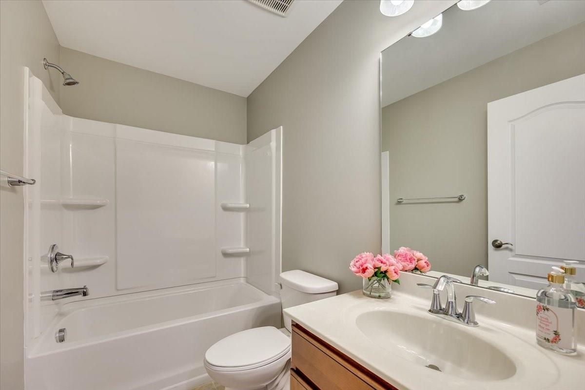 2350 Talon Point Circle Fort Mill, SC 29715 - Photo 40 of 45 a bathroom with a sink mirror toilet and bathtub