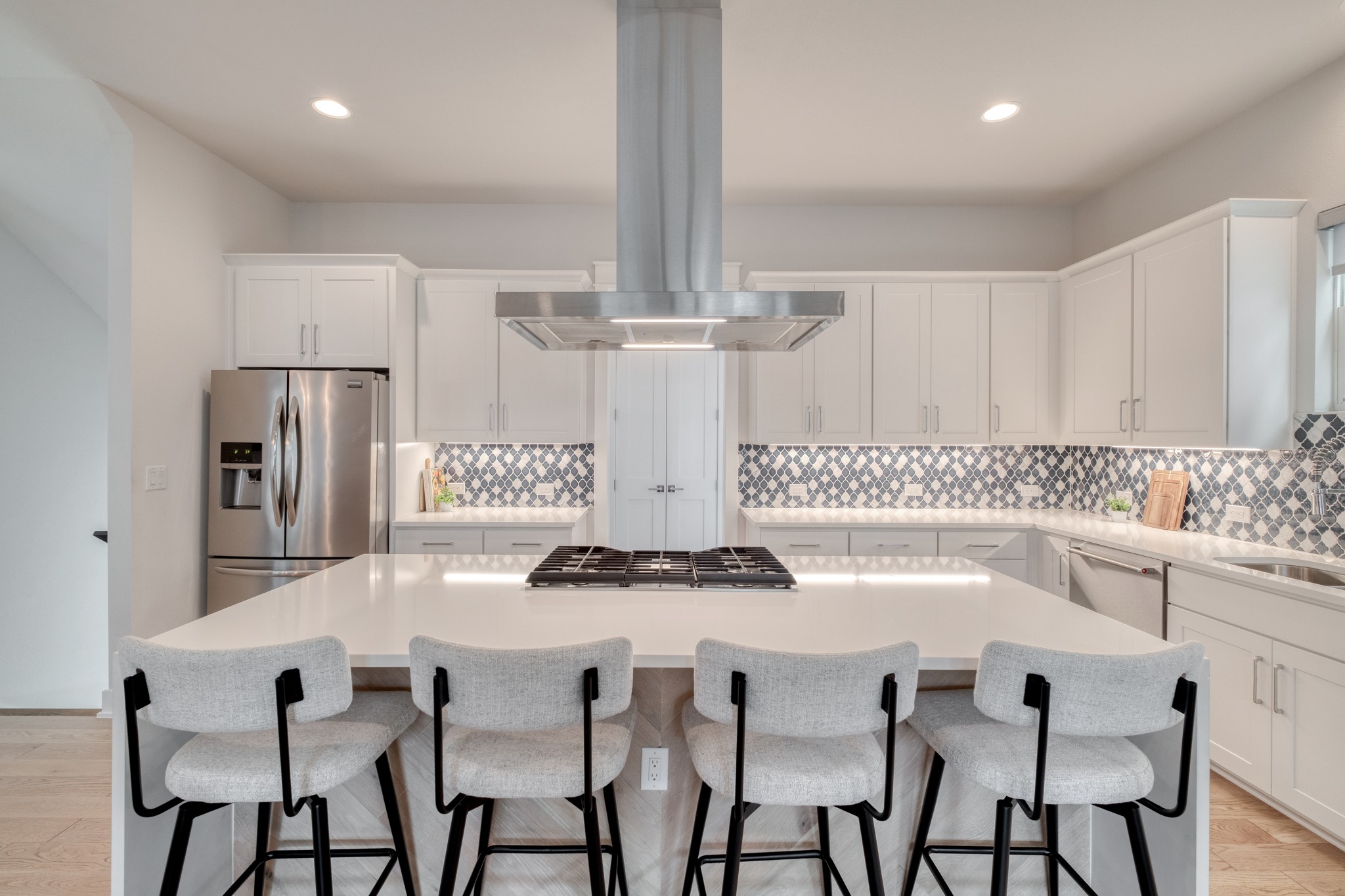5002 Pecan Springs Road, Unit 7 Austin, TX 78723 - Photo 10 of 34 The kitchen features a large center island and quartz countertops, providing plenty of room for meal prep and casual seating