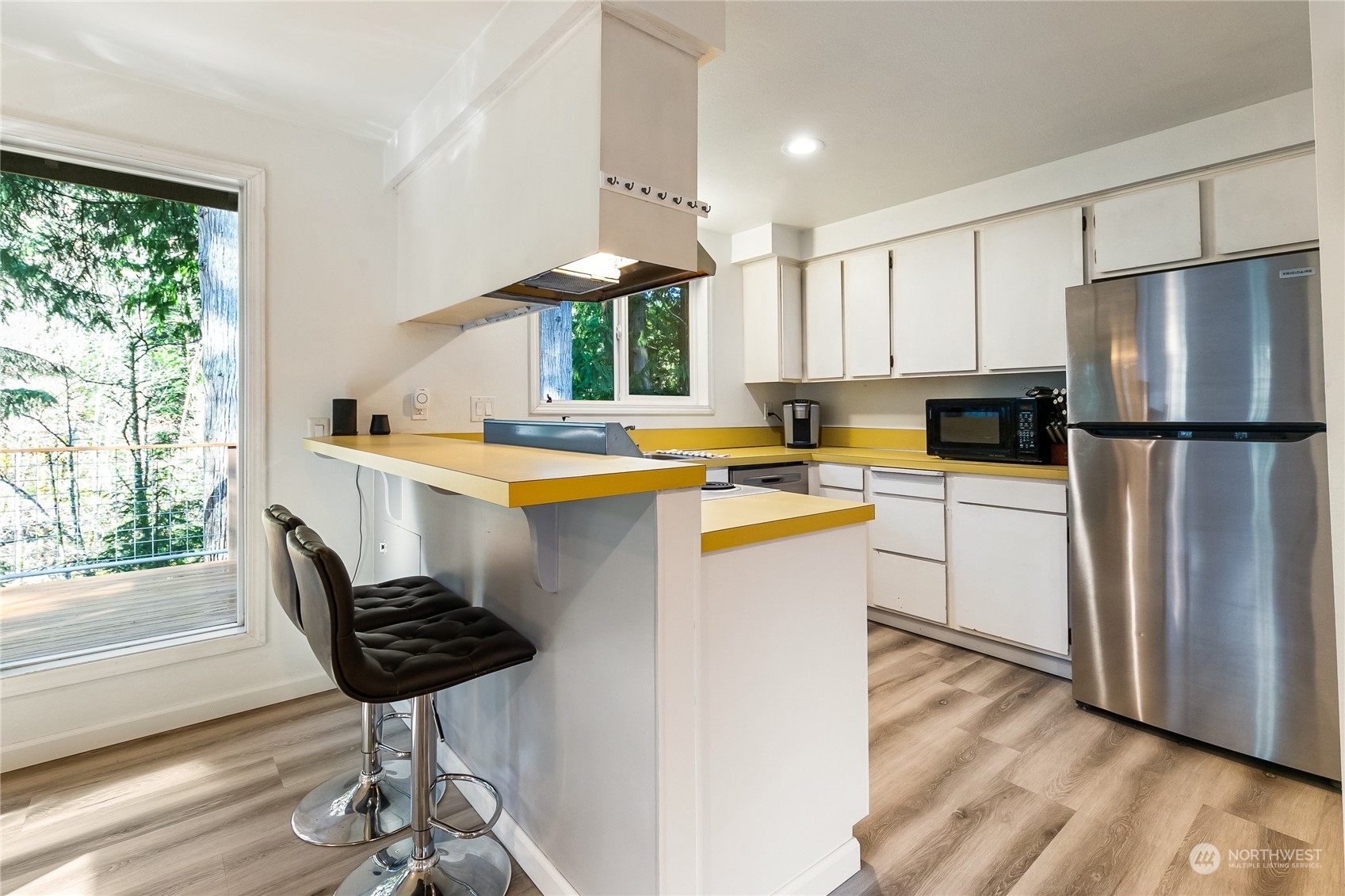 8 Topper Drive Bellingham, WA 98229 - Photo 7 of 32 a kitchen with a refrigerator a stove a sink and a potted plant