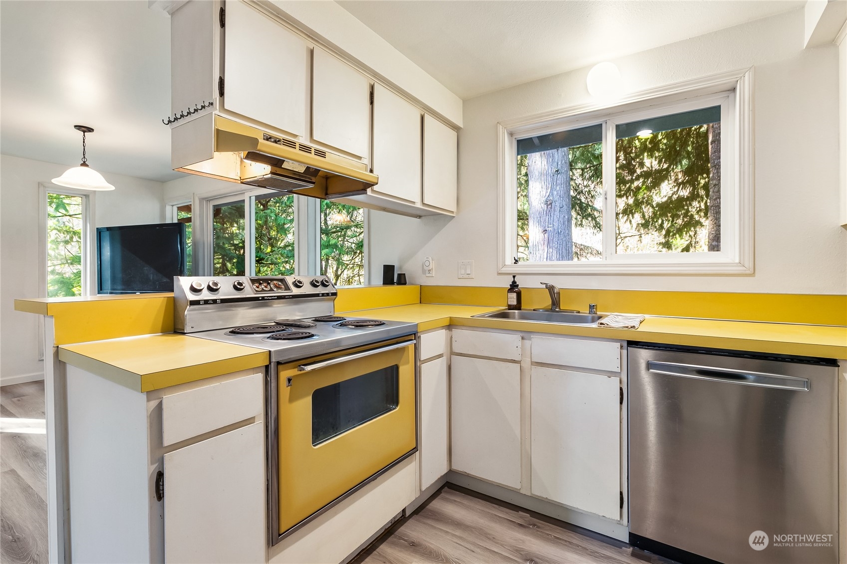 8 Topper Drive Bellingham, WA 98229 - Photo 8 of 32 a kitchen with stainless steel appliances granite countertop a sink a stove and a wooden floors