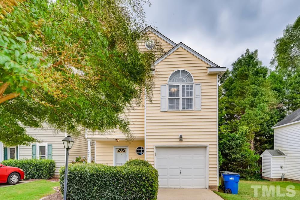 4008 Beaufain Street Raleigh, NC 27604 - Photo 2 of 30 a view of a house with a yard and plants