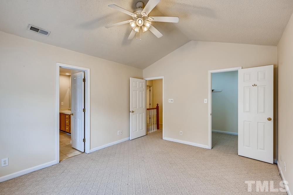 4008 Beaufain Street Raleigh, NC 27604 - Photo 17 of 30 a view of a big room with chandelier fan and closet area