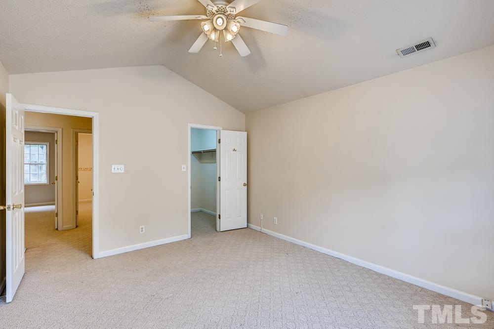 4008 Beaufain Street Raleigh, NC 27604 - Photo 18 of 30 a view of an empty room and chandelier fan