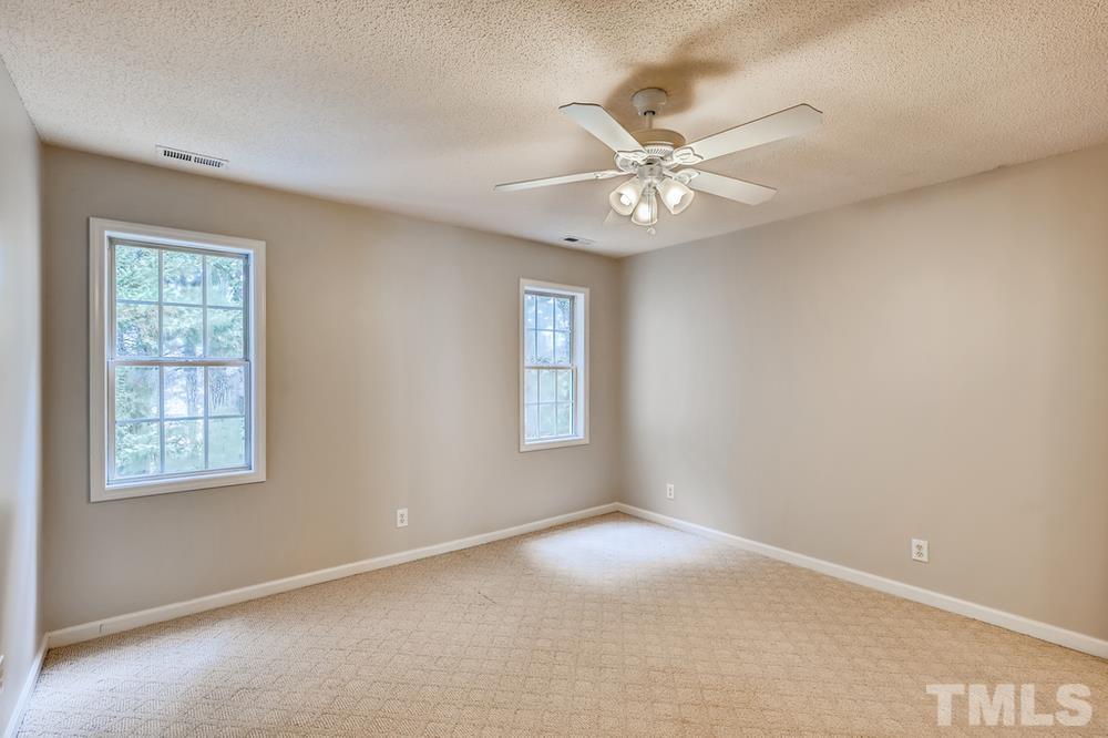 4008 Beaufain Street Raleigh, NC 27604 - Photo 25 of 30 an empty room with windows and fan