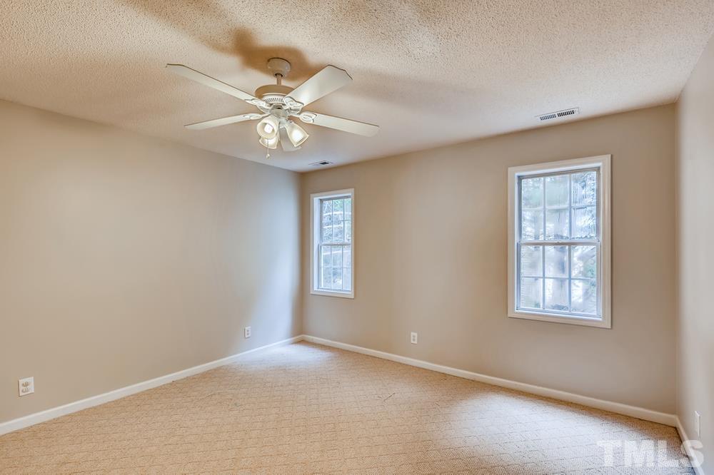 4008 Beaufain Street Raleigh, NC 27604 - Photo 26 of 30 an empty room with windows and fan