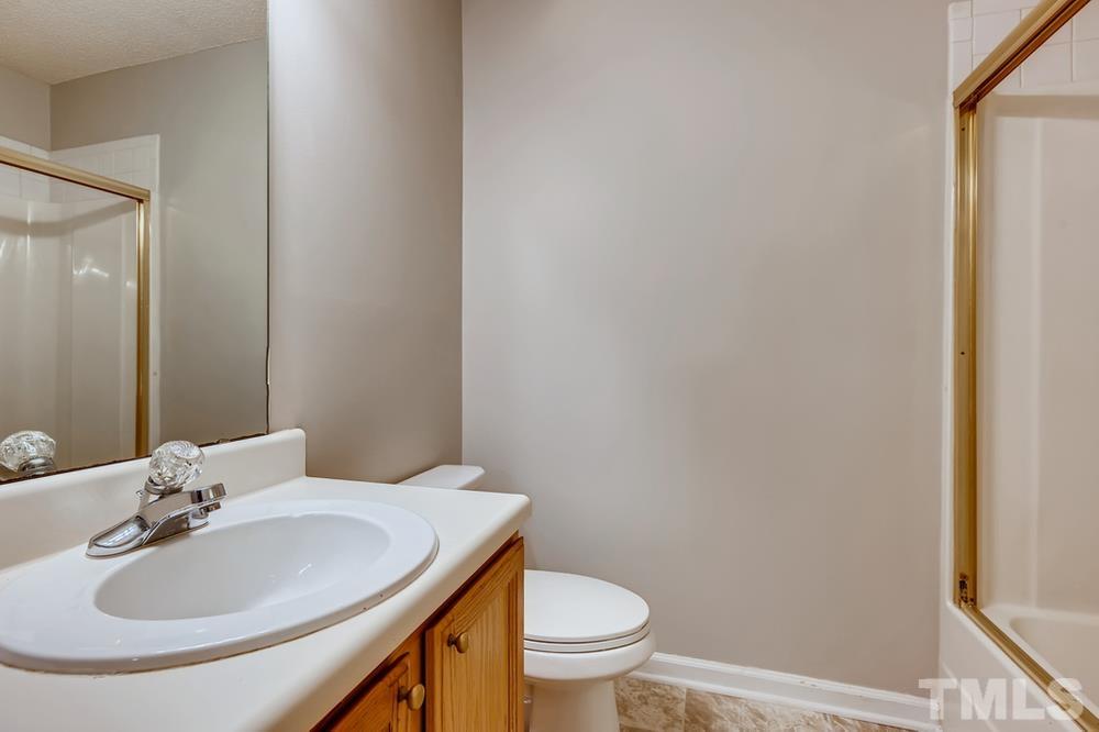 4008 Beaufain Street Raleigh, NC 27604 - Photo 28 of 30 a bathroom with a sink and a toilet