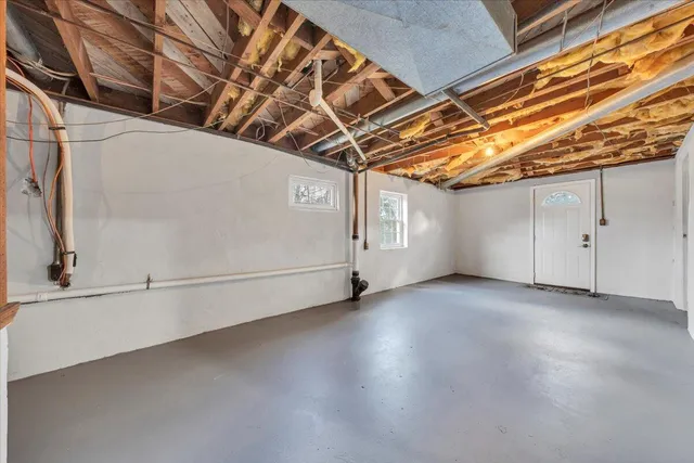 a view of a storage & utility room with stairs