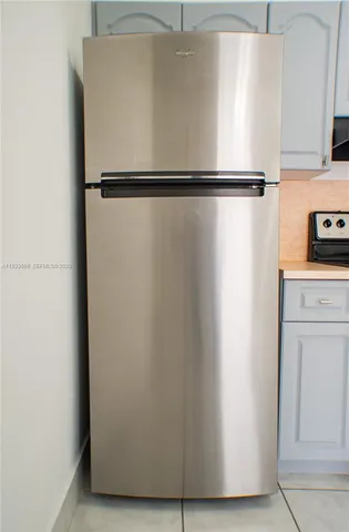a stove top oven sitting inside of a kitchen