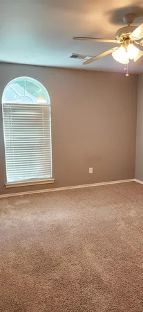 an empty room with a empty space and a window