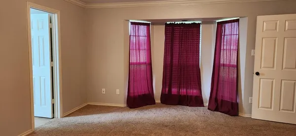 a view of a room with windows
