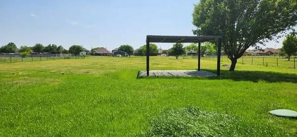 a view of a house with yard and tree s