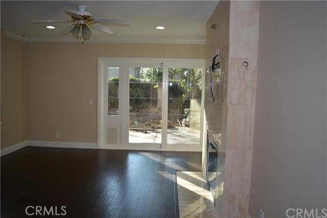 8 Bellezza Irvine, CA 92620 - Photo 12 of 39 Family Room with fireplace and slider to backyard