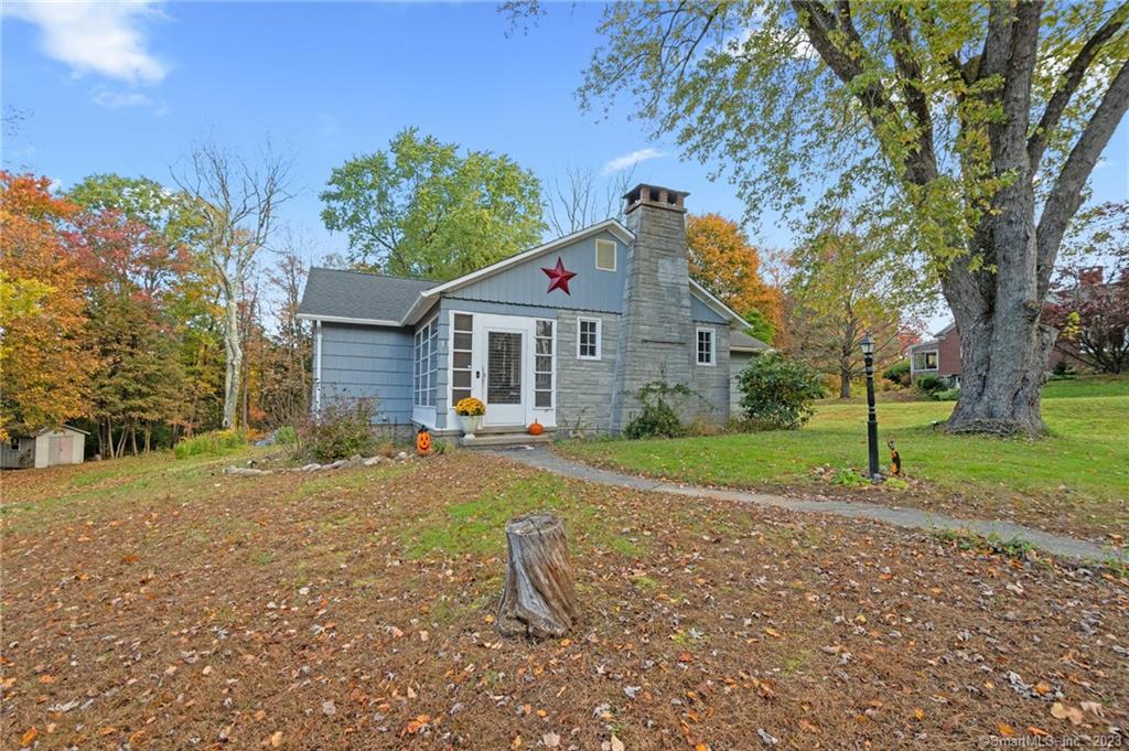 142 East Hill Road Torrington, CT 06790 - Photo 1 of 1 a front view of a house with a yard and garage