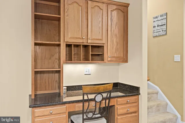 a kitchen with stainless steel appliances granite countertop a stove refrigerator sink and cabinets