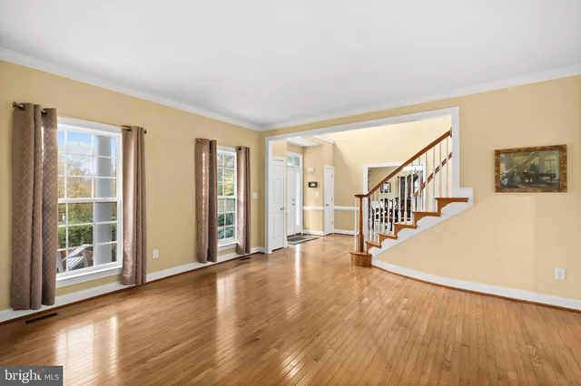 a view of a livingroom with furniture and a ceiling fan